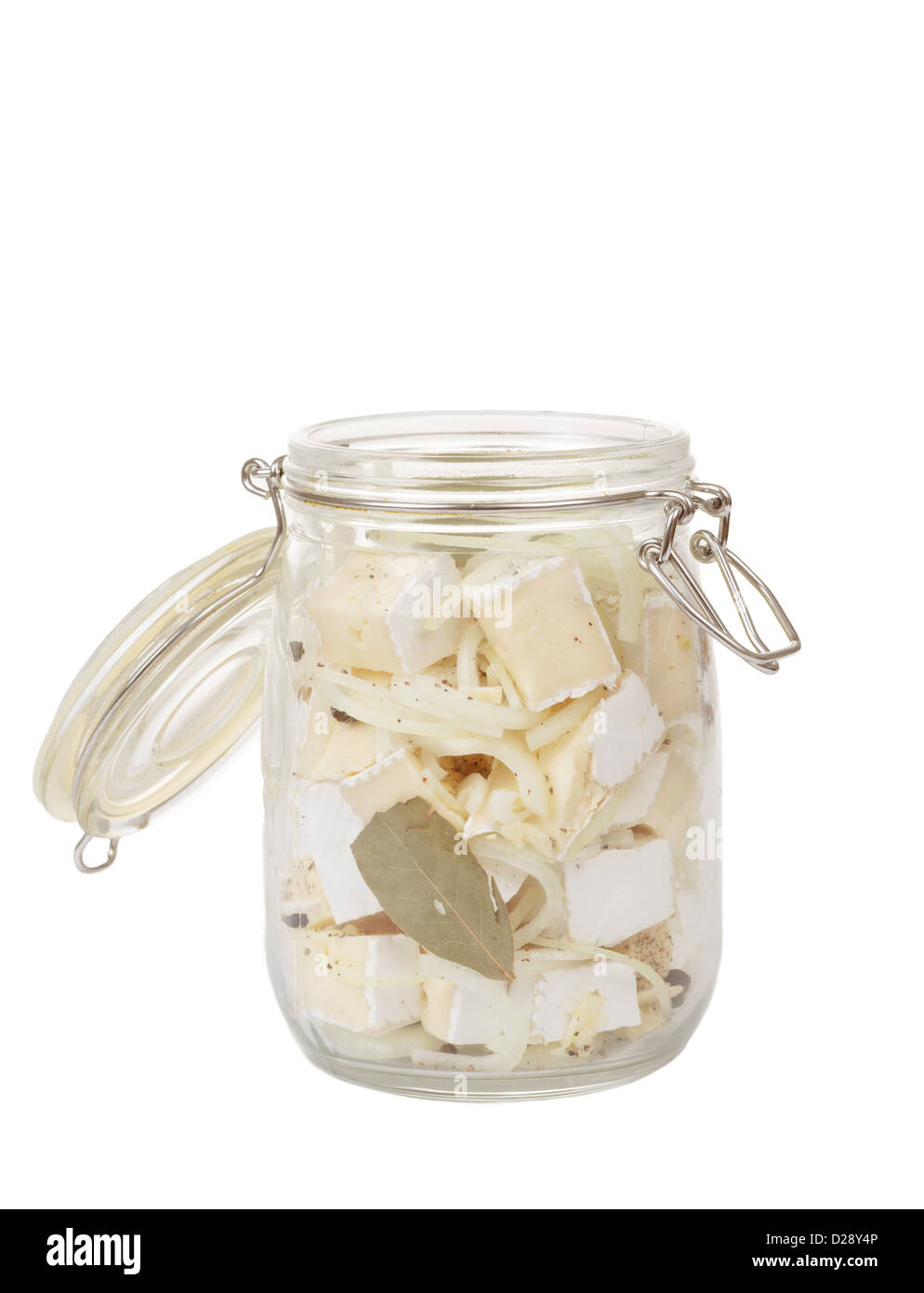 homemade spicy marinated cheese with oil, onion, garlic and spicy spices on white Stock Photo