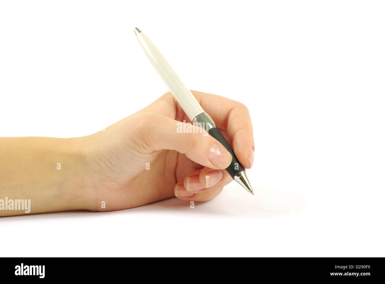 Closeup of a hand writing, on isolated on white background. Stock Photo