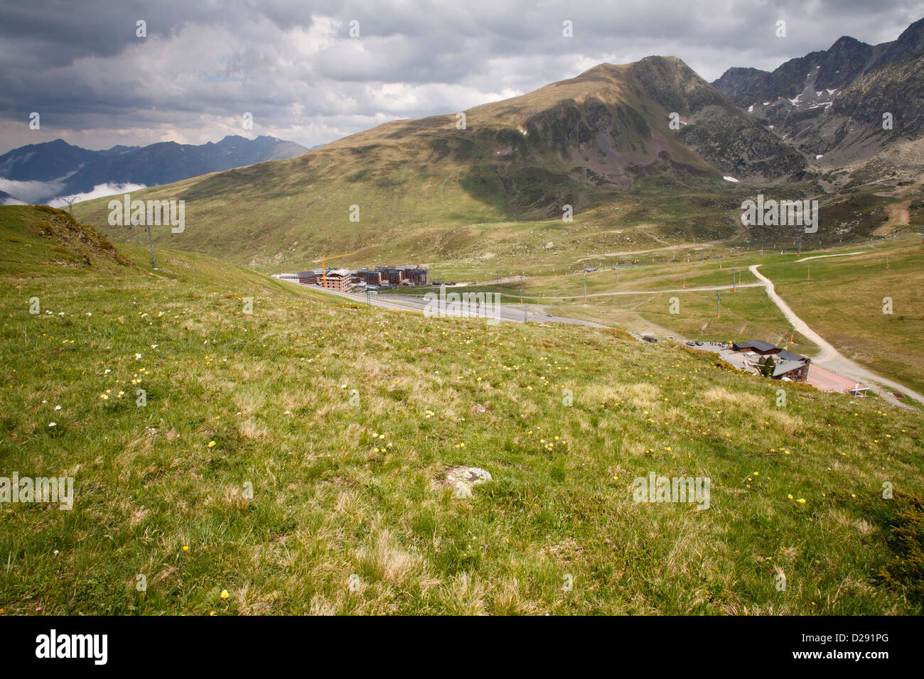 Alpine meadow above ski development in the Pyrenees. Passa de la Casa, Andorra. June. Stock Photo