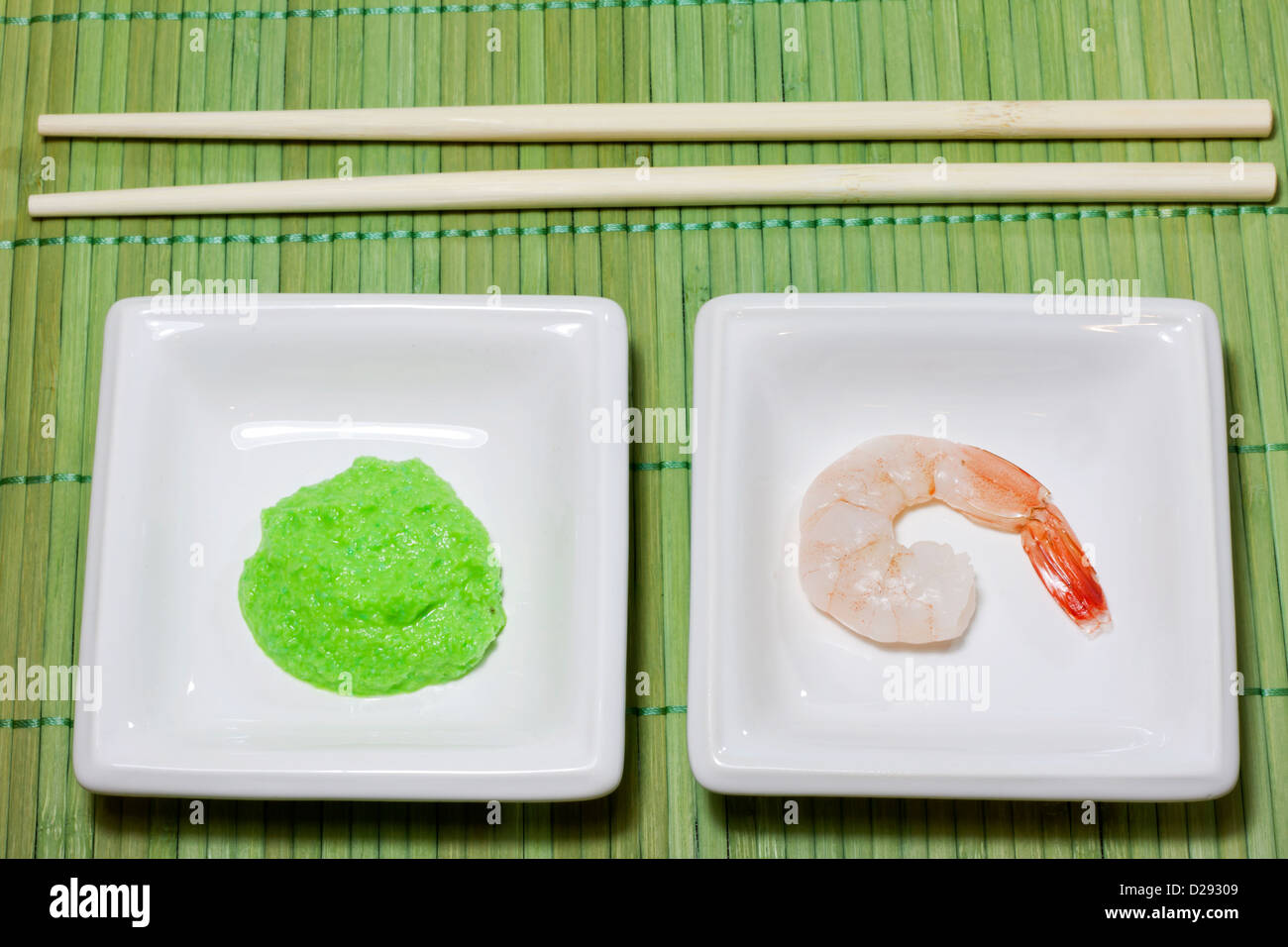 Sushi shrimp and wasabi on bamboo mat Stock Photo