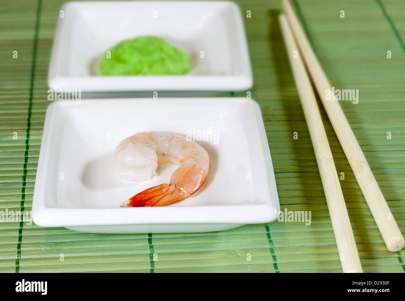 Sushi shrimp and wasabi on bamboo mat Stock Photo