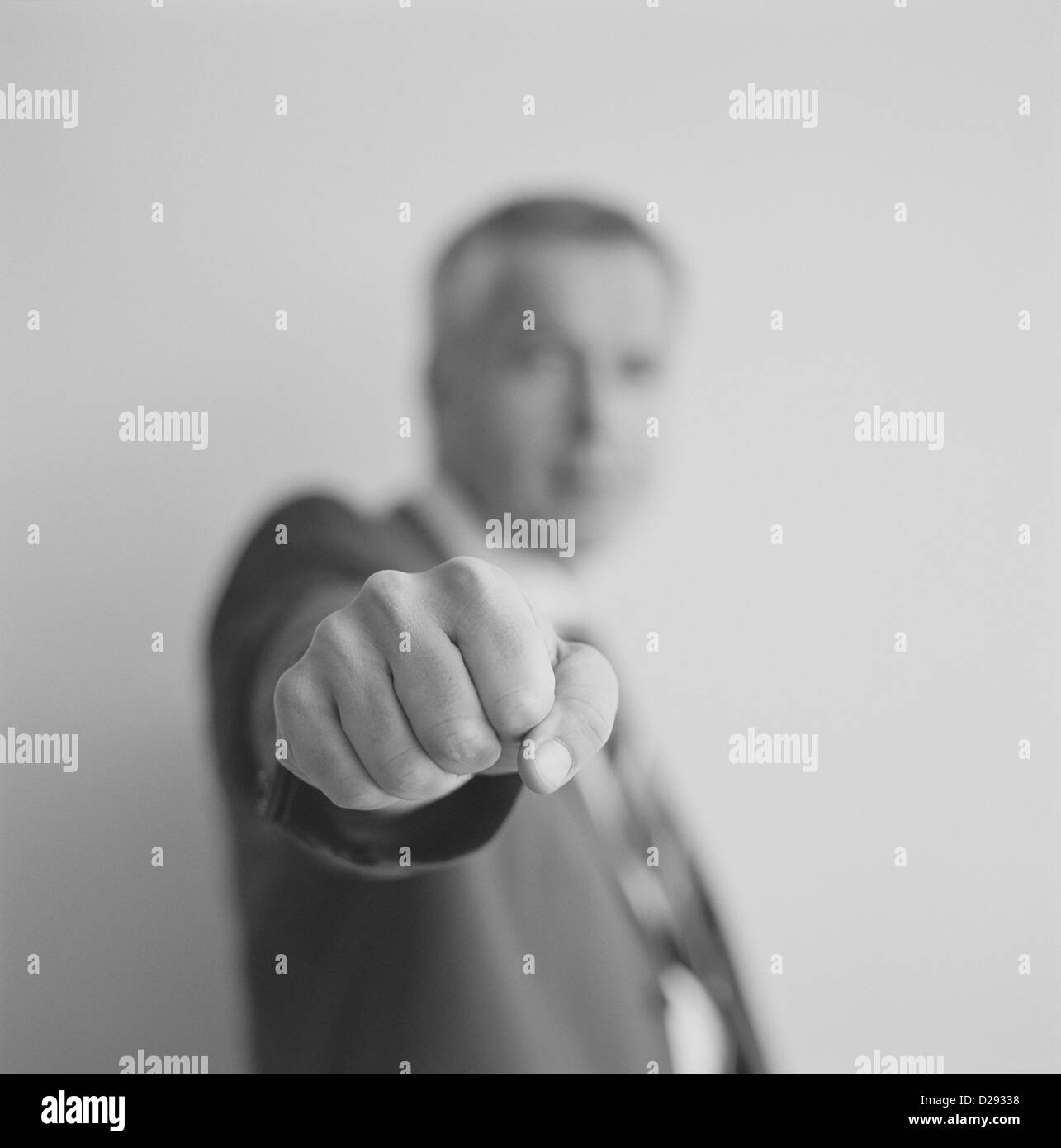 black and white businessman making fist License free except ads and billboards Stock Photo