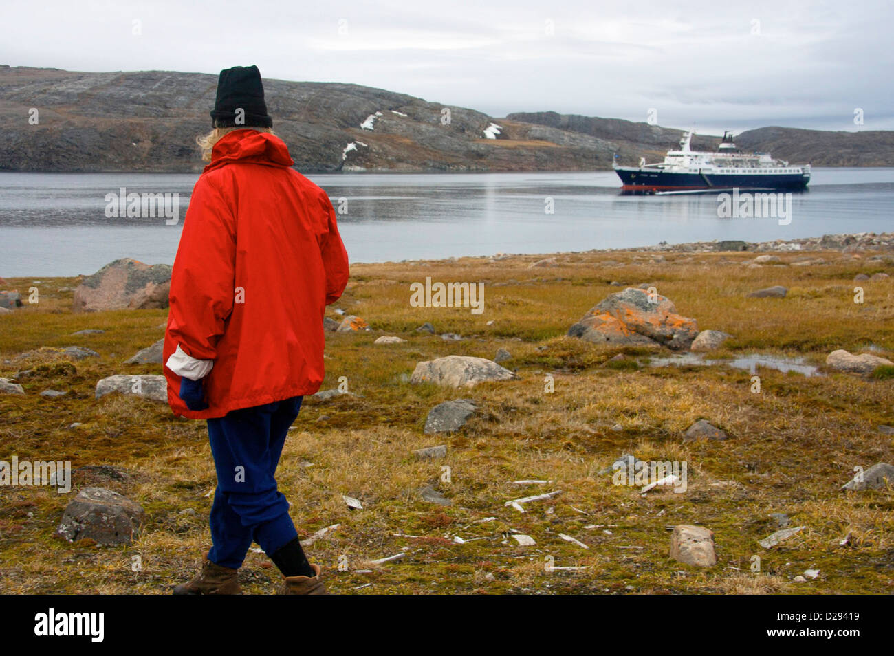 Cruise North Expedition Shore Excursion Passenger With Lyubov Orlova In Background, Northwest Passage, Nunavut Stock Photo