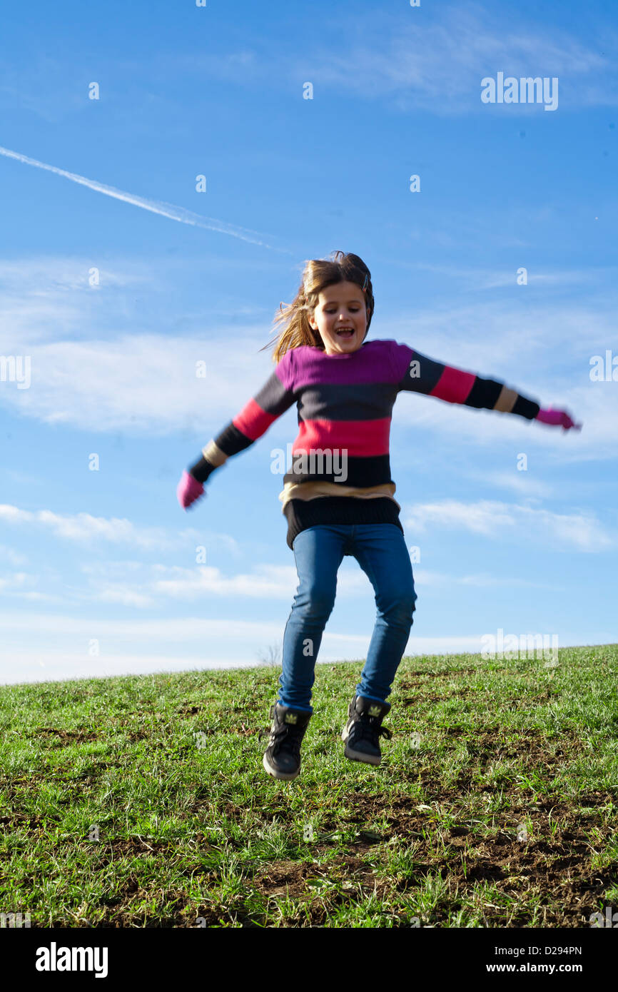 Happy girl jumping hi-res stock photography and images - Alamy