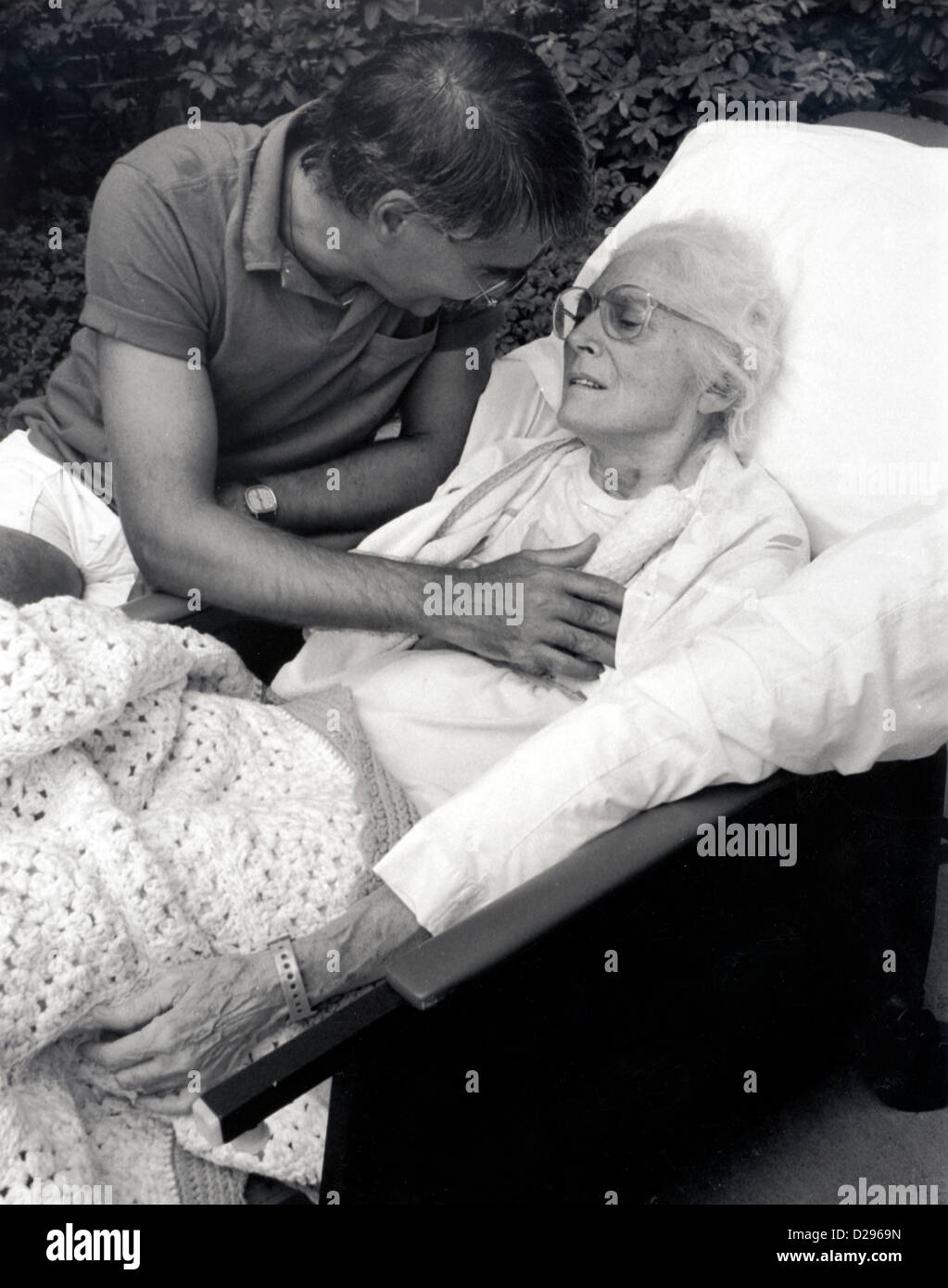 Son Talking To His Mother In Hospital Bed (Alzheimer’S Patient Stock Photo Alamy