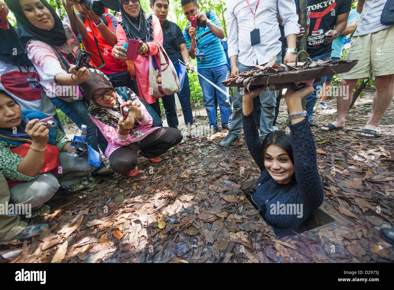 Vietnam, Ho Chi Minh City, Cu Chi Tunnels, Tourists Emerging from