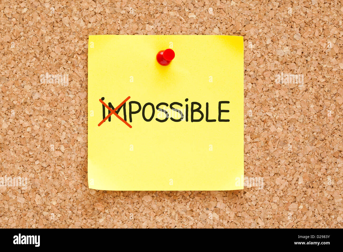 The word Impossible turning into Possible on yellow sticky note. Stock Photo