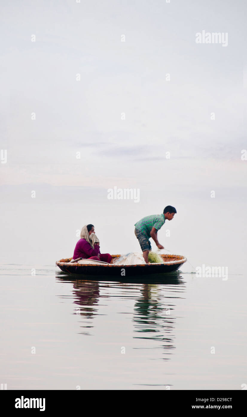 A Mother and son fishing at vembanadu lake at Ernakulam, Kerala, India Stock Photo Alamy