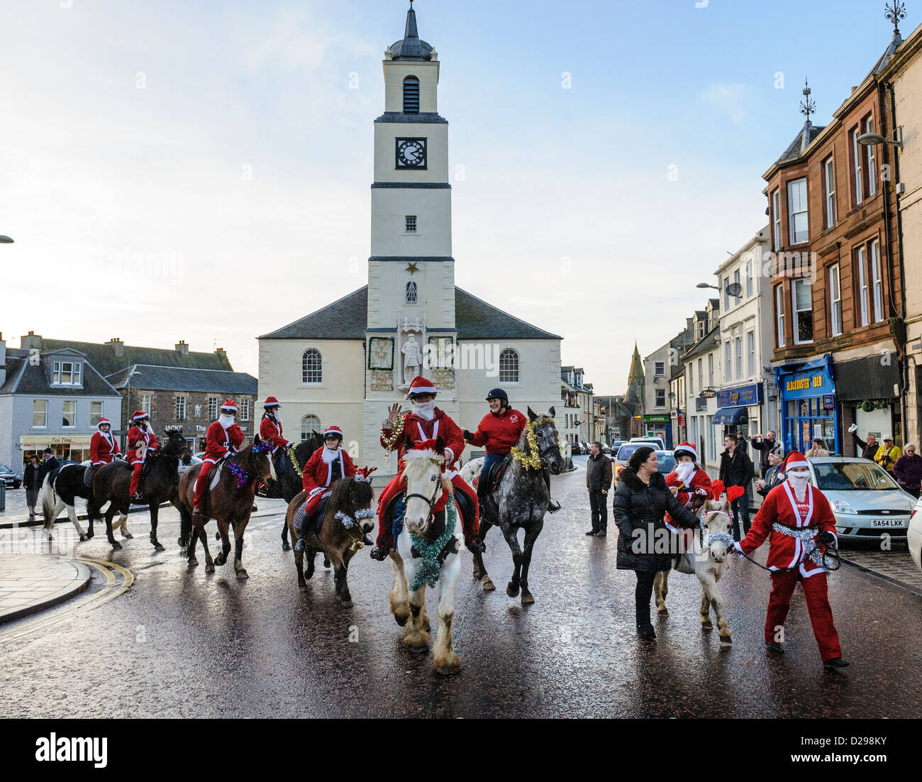 A Taste of Lanark  -  Santa Parade rides down the High Street, Lanark just before Christmas Stock Photo