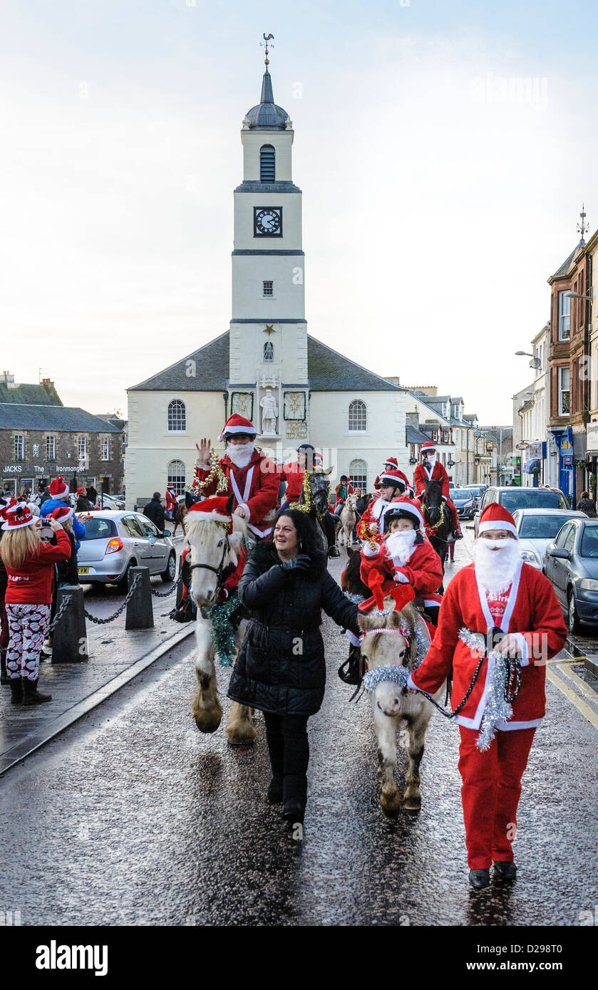 A Taste of Lanark Santa Parade rides down the High Street, Lanark