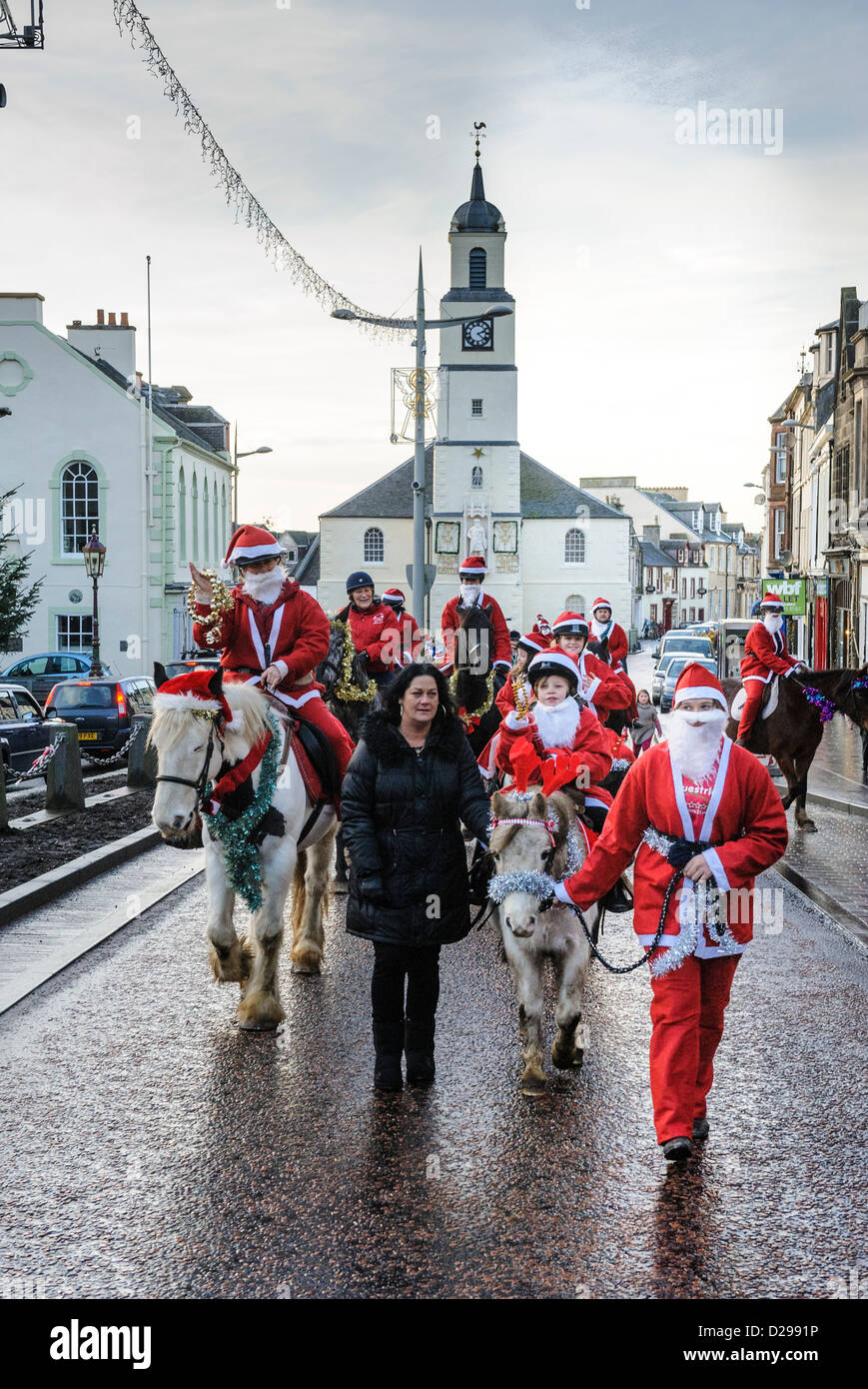 A Taste of Lanark Santa Parade rides down the High Street, Lanark