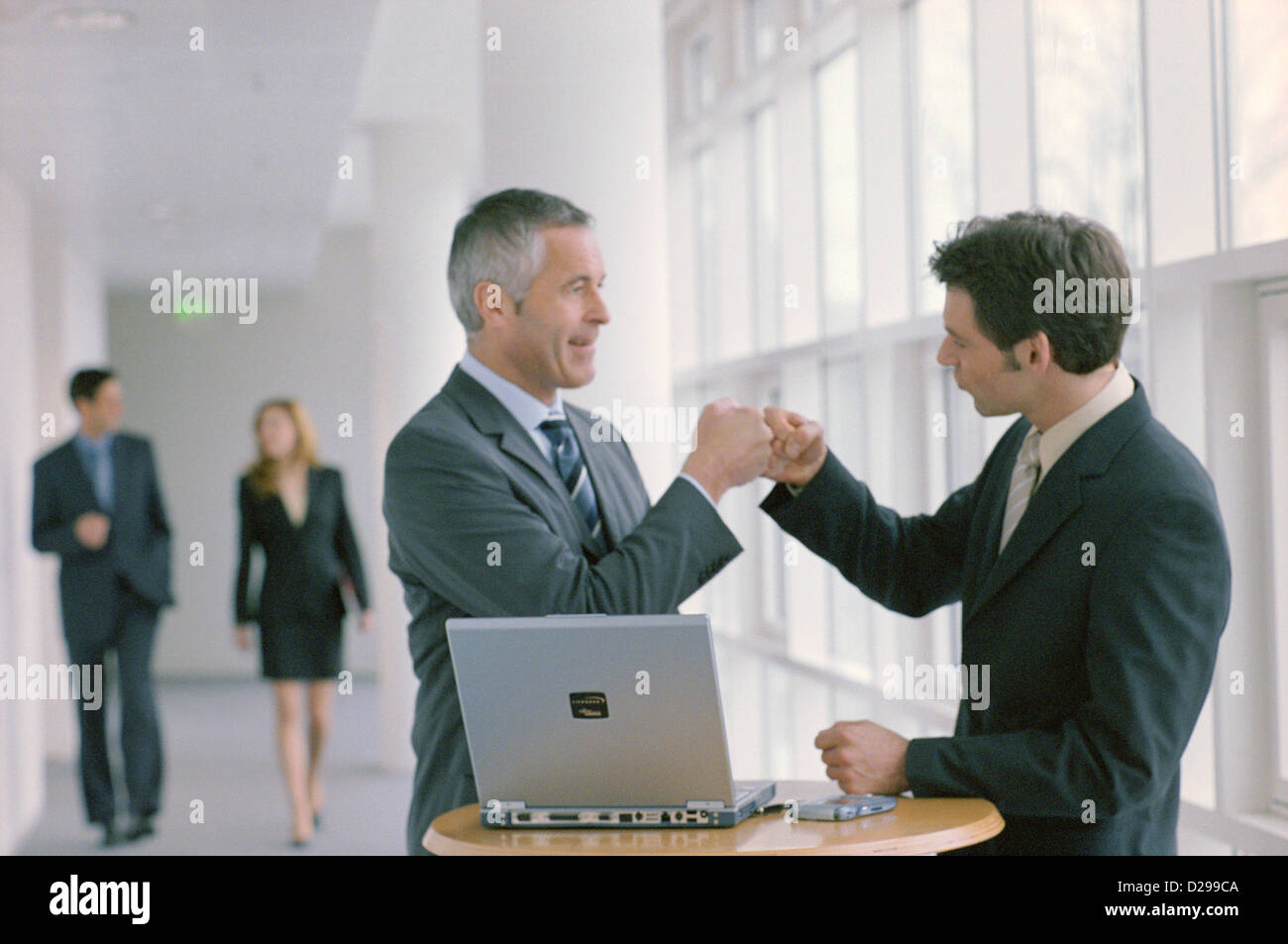 Two business people to give so a high five License free except ads and outdoor billboards Stock Photo