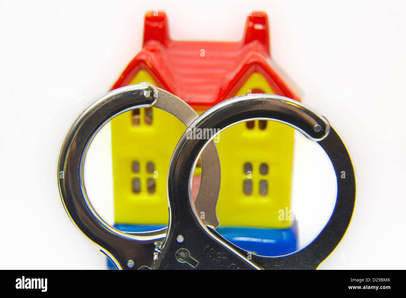 Concept, property market, handcuffs, negative equity home house Stock Photo