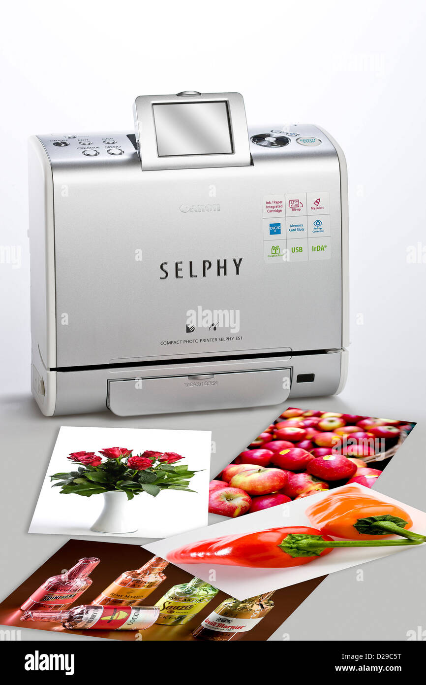 Photo printer and printed photos Stock Photo - Alamy