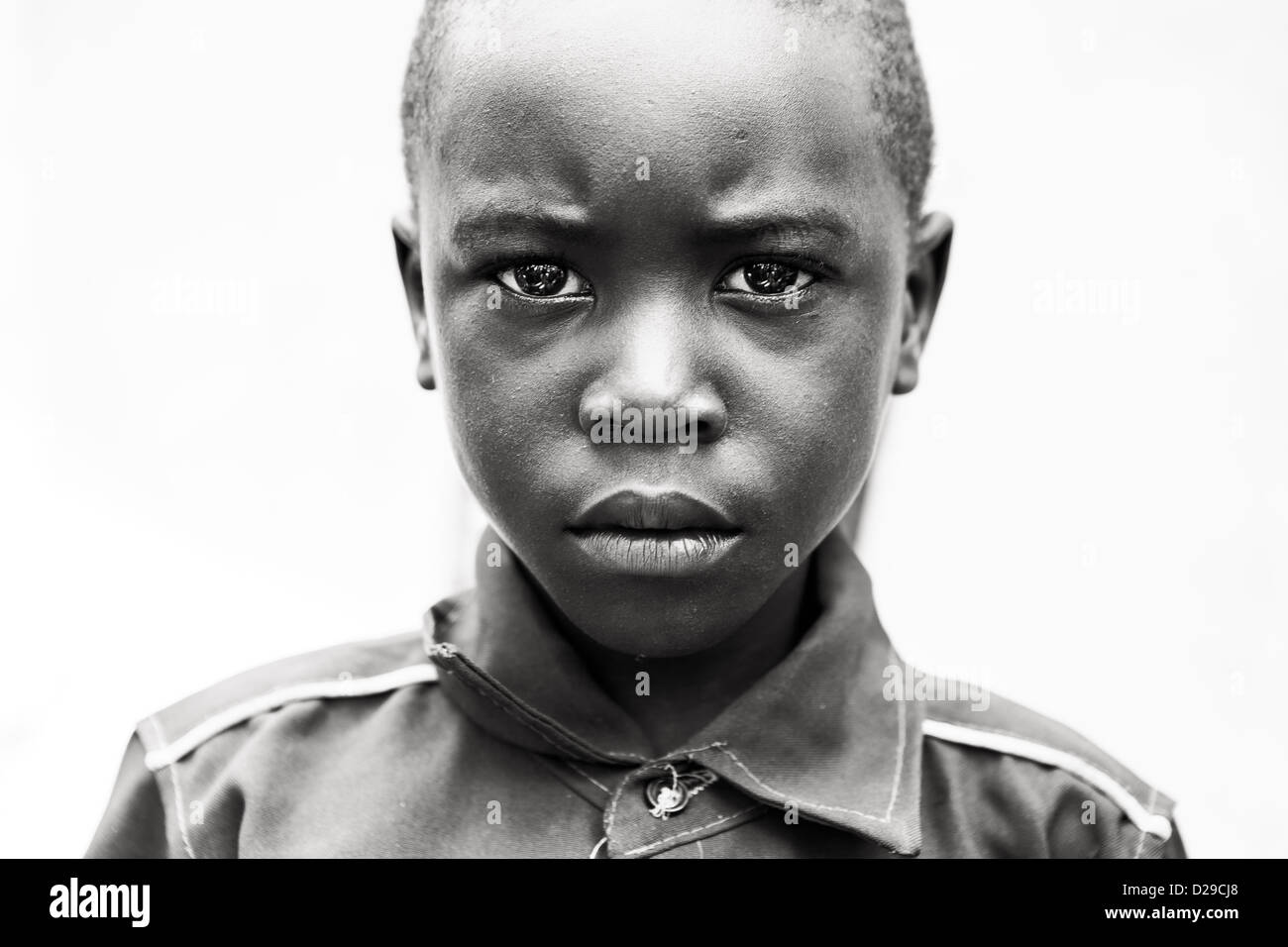 An African child looking intensely into the camera. Stock Photo