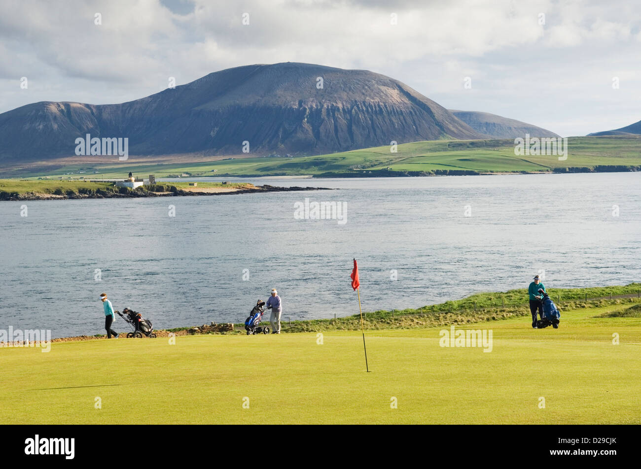Golfers on Stromness Golf Course, Orkney Islands, Scotland. Stock Photo