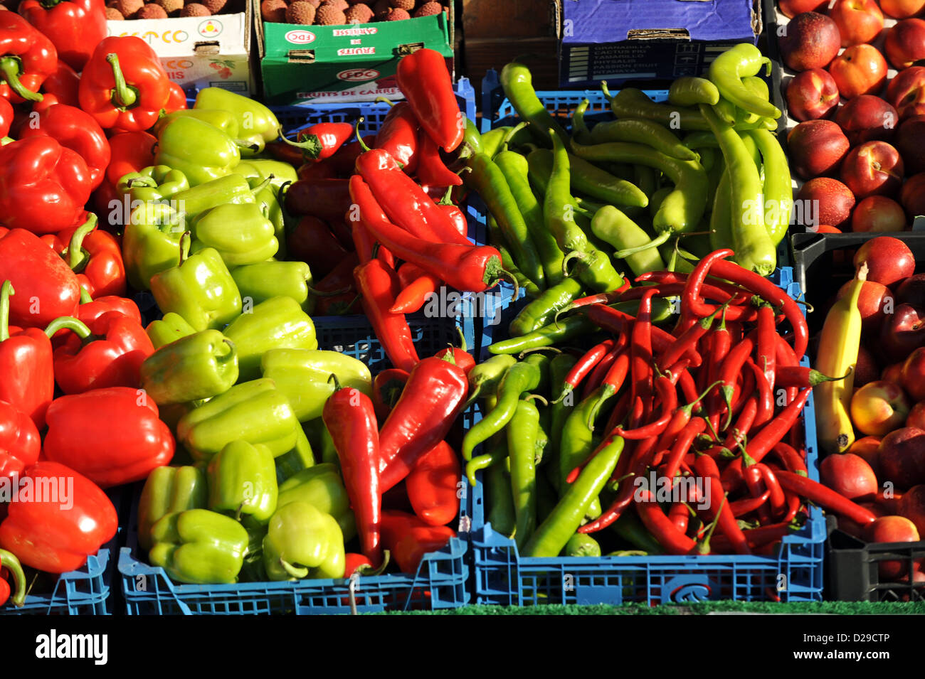 Fresh red and green chilli peppers on display at traditional greengrocers shop Brighton UK Stock Photo
