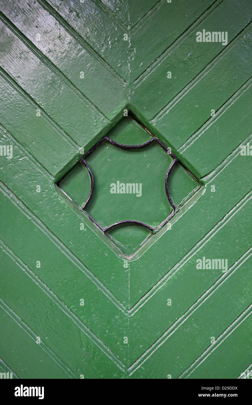 Green wooden door detail of an ancient gate, background Stock Photo