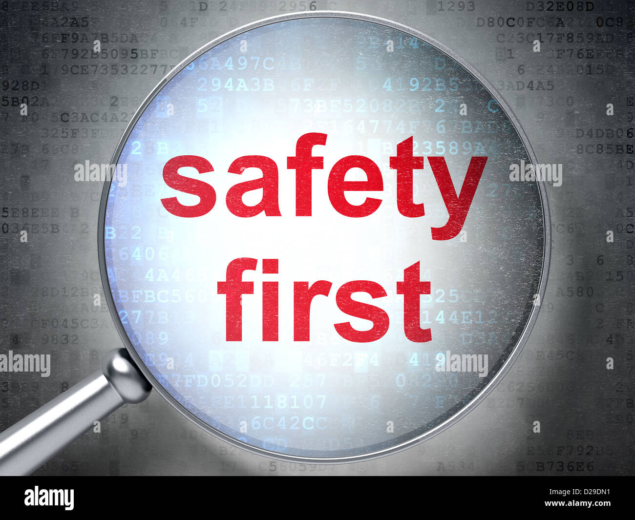 Magnifying optical glass with words safety first on digital background ...