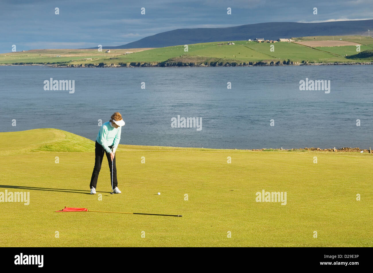 Golfer on Stromness Golf Course, Orkney Islands, Scotland. Stock Photo