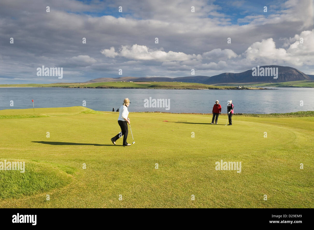 Golfers on Stromness Golf Course, Orkney Islands, Scotland. Stock Photo