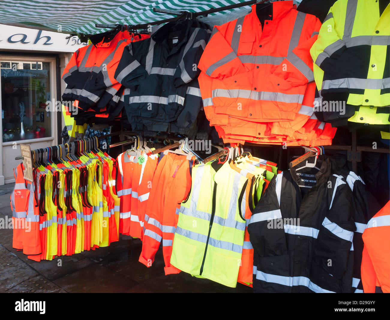 Low cost high visibility  work clothing on sale from a market stall in the North of England Stock Photo