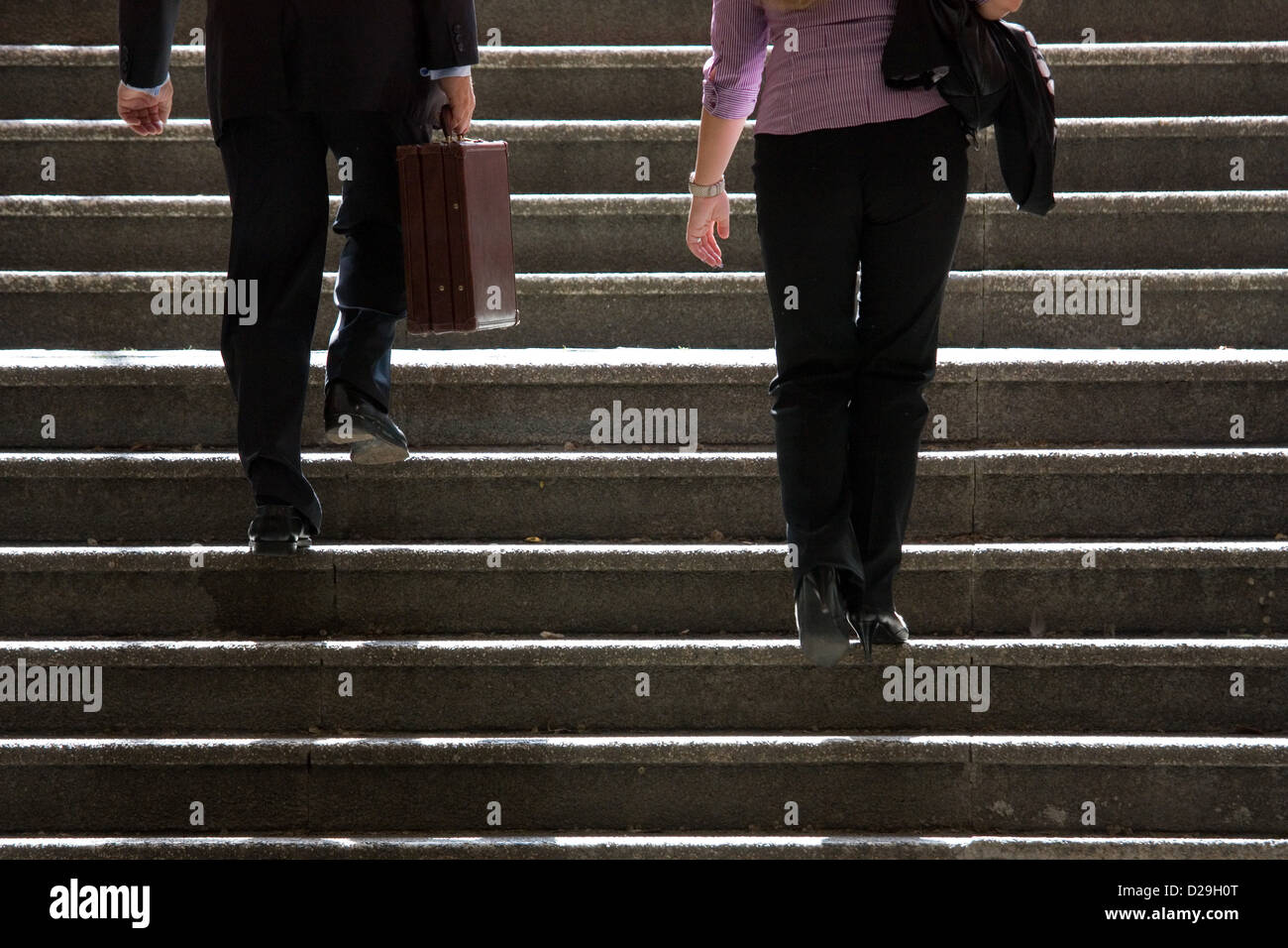 Berlin, Germany, a woman and a man go up the stairs Stock Photo