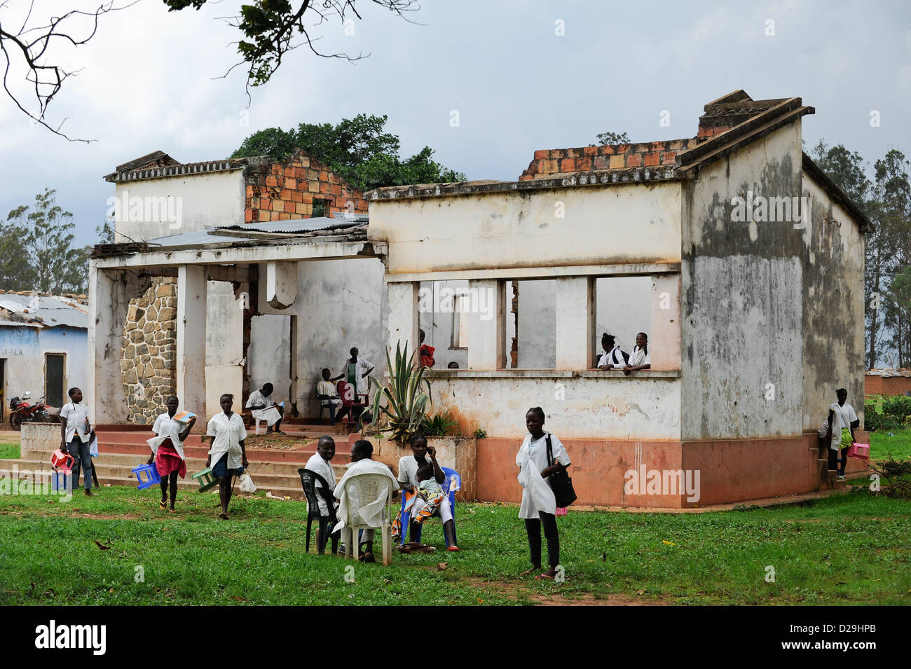 ANGOLA Kwanza Sul, children in during civil war destroyed school building in village Sao Pedro, due to corruption there are no funds from the government for reconstruction Stock Photo