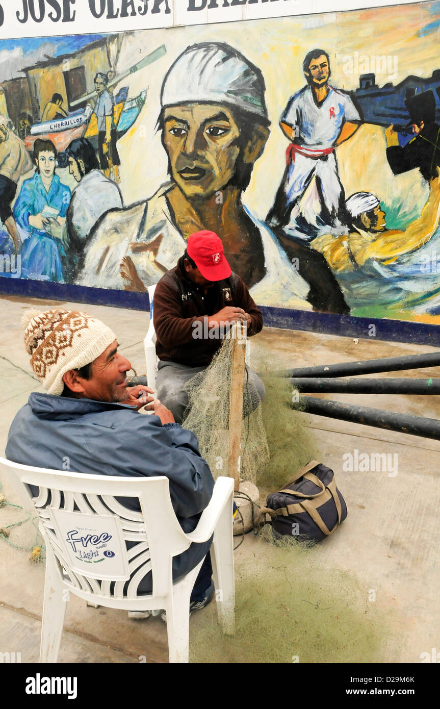 Fisherment Mending Net, Lima, Peru Stock Photo