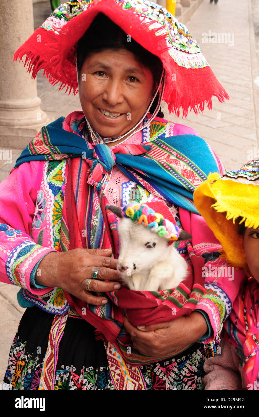 Native Woman With Lamb, Cuzco, Peru Stock Photo