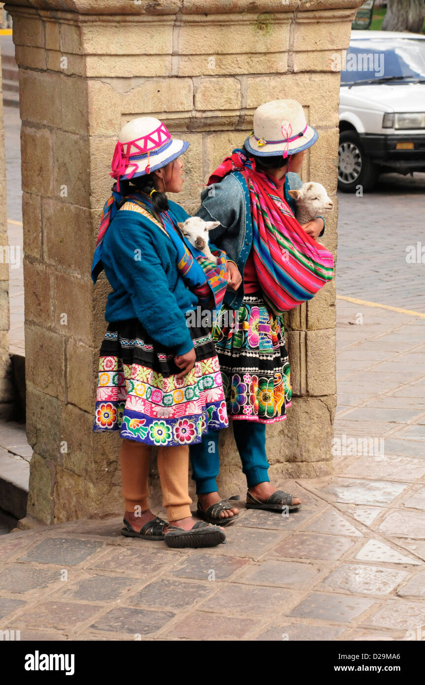 Girls With Lambs, Cuzco, Peru Stock Photo