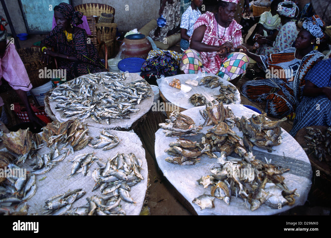 Women selling dried fish at a street market in Mali, West Africa. Stock Photo