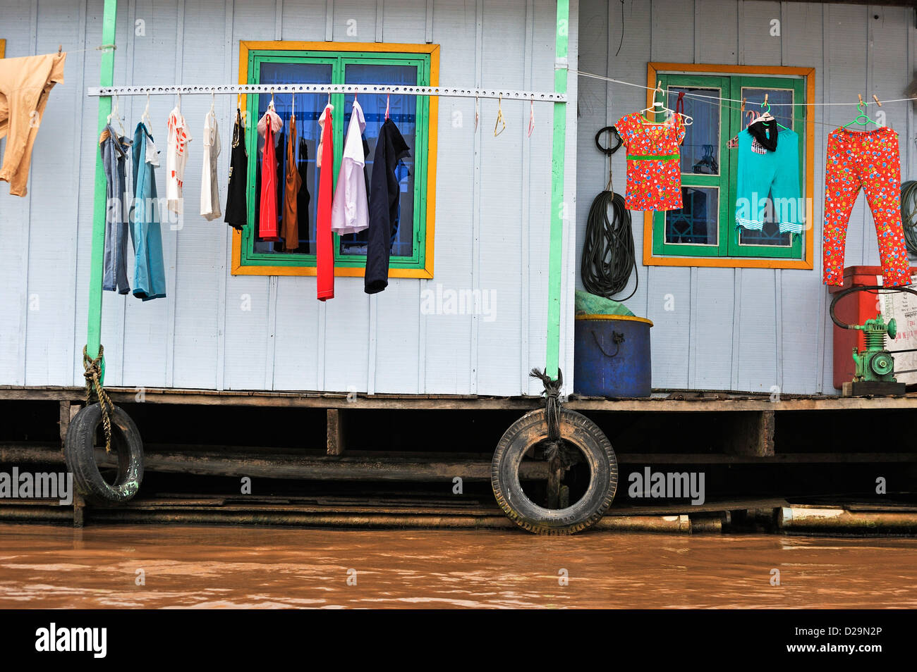 Houseboat with laundry on the Mekong River, Cai Be, Tien Giang Province, Vietnam Stock Photo