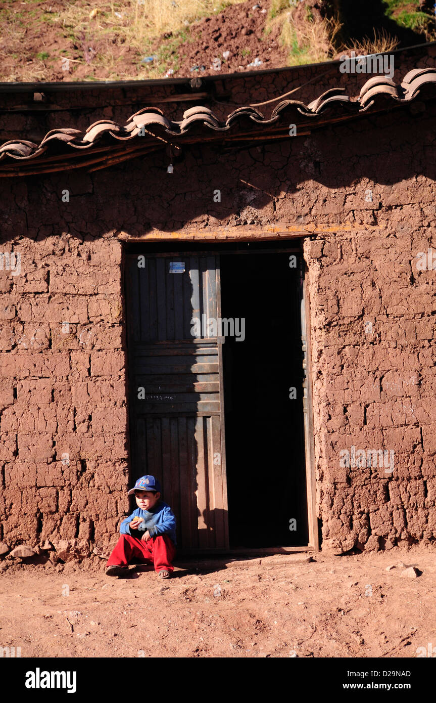 Boy In Doorway, Peru Stock Photo