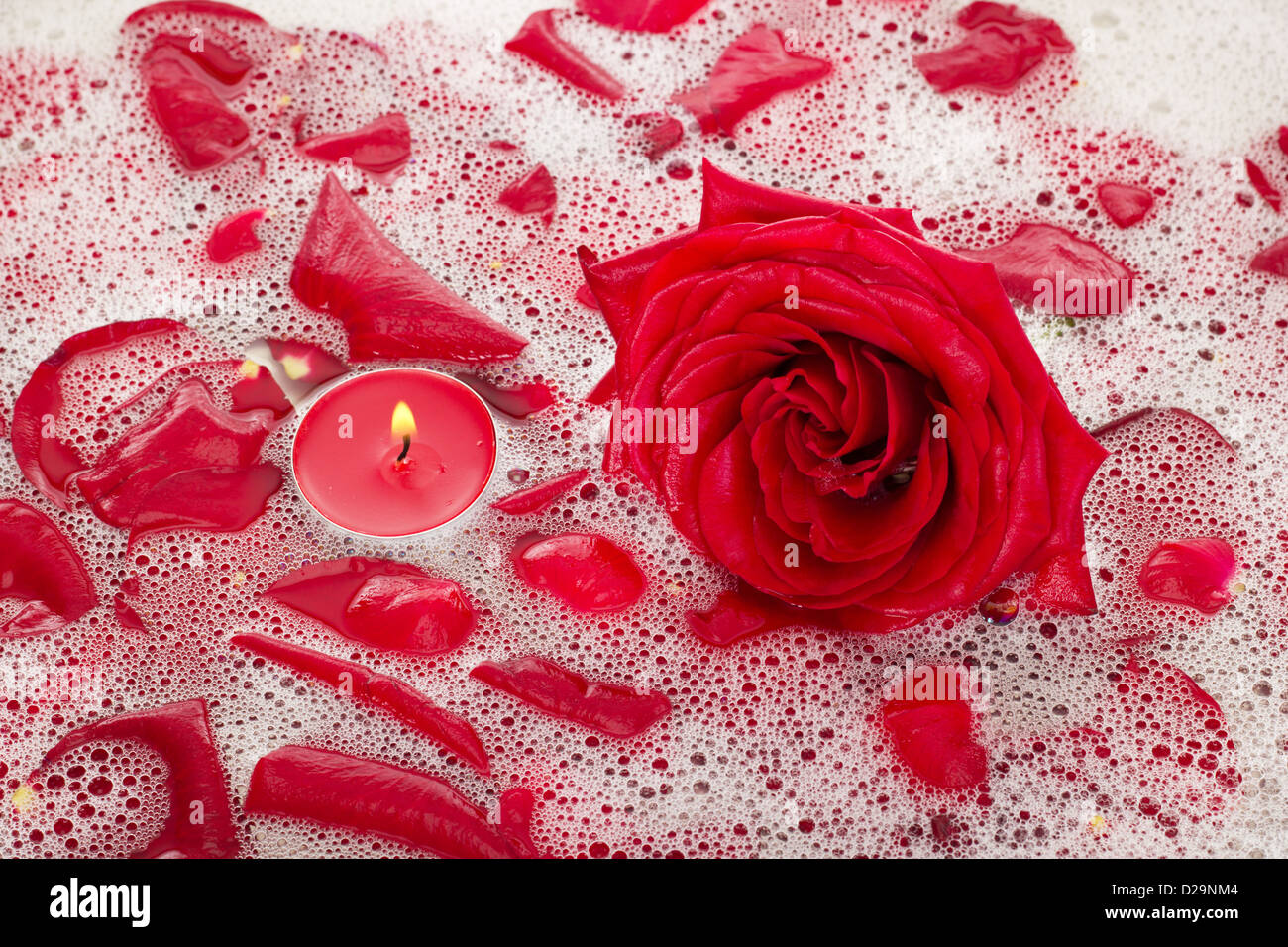 Bath water with rose petals Stock Photo