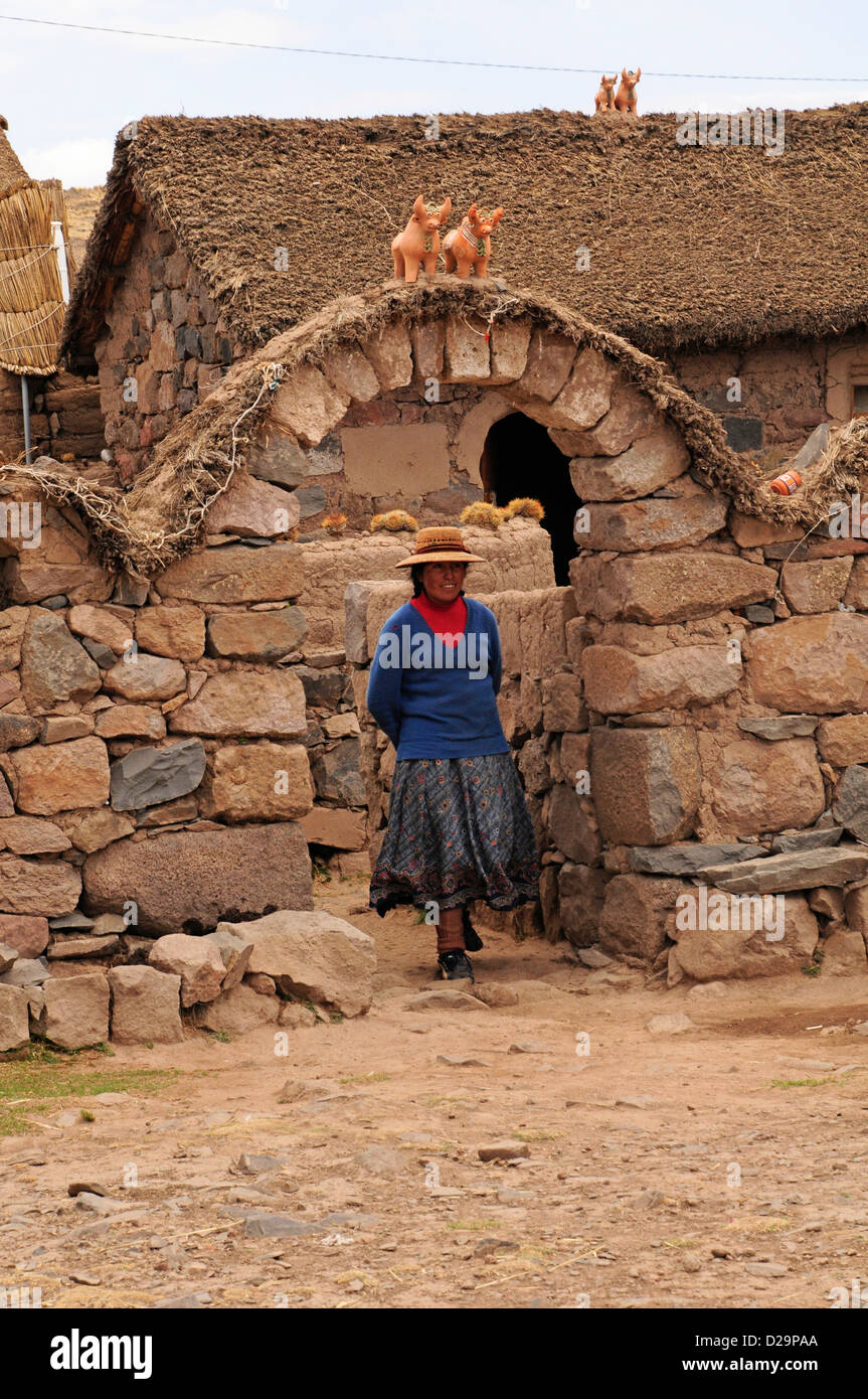 Woman Leaving Farm House, Peru Stock Photo