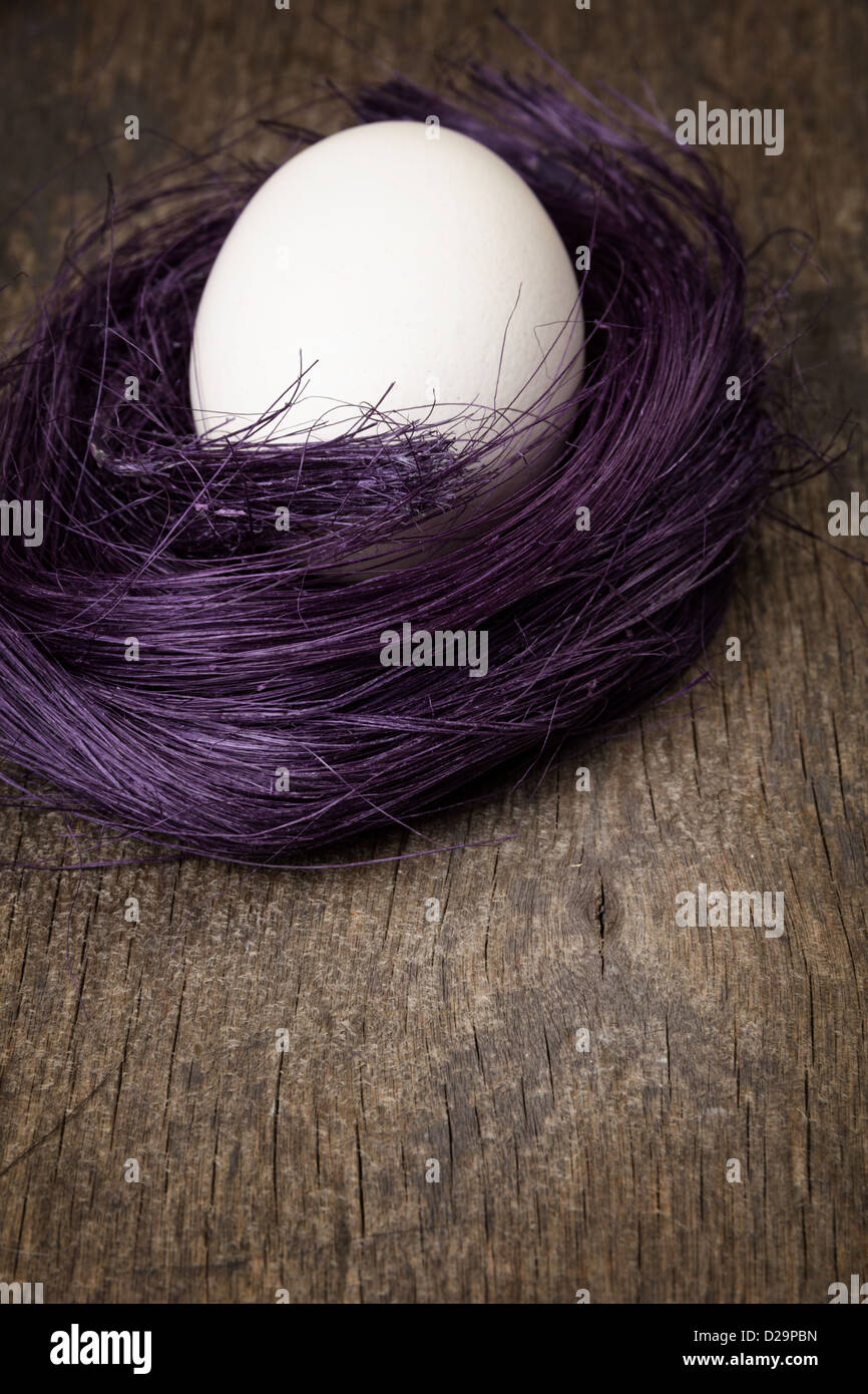 nest with egg on wooden surface, easter background Stock Photo - Alamy