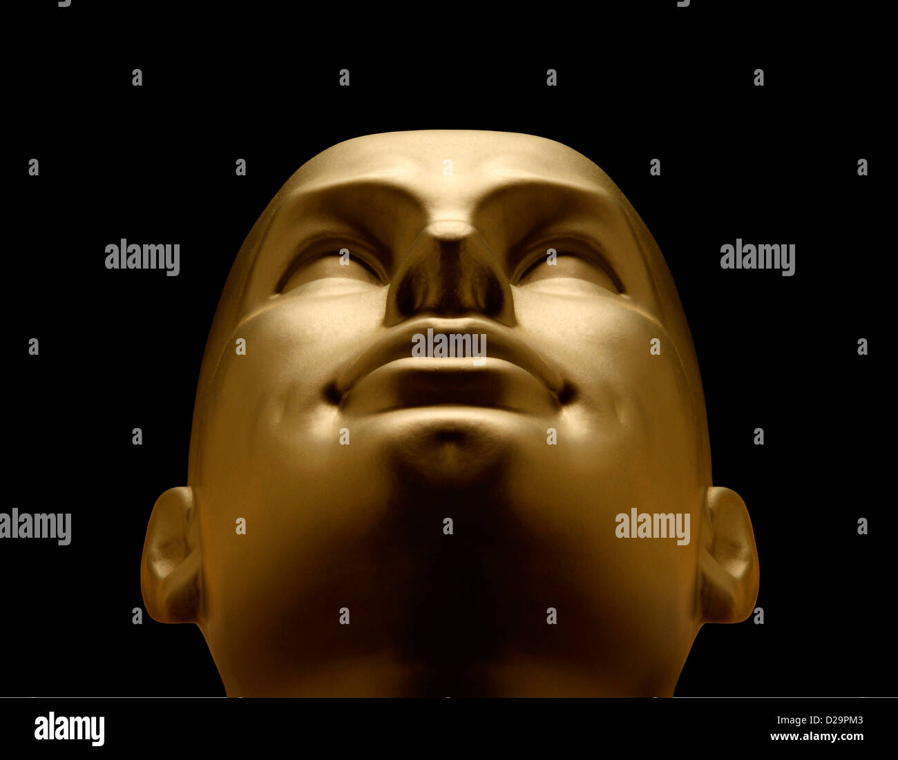 Gold mannequin head looking up Stock Photo