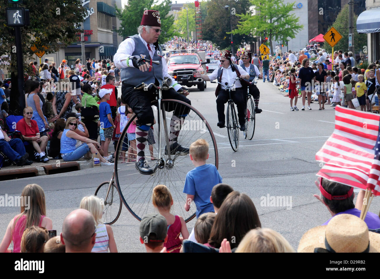 Big Wheel Cyclists In Parade, Janesville, Wisconsin Stock Photo