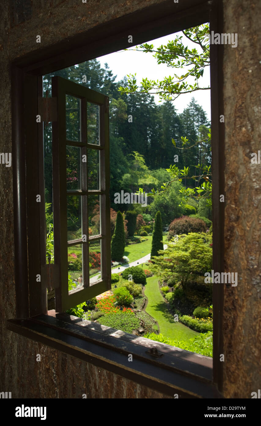 SUNKEN GARDEN BUTCHART GARDENS THROUGH WINDOW FRAME VICTORIA VANCOUVER