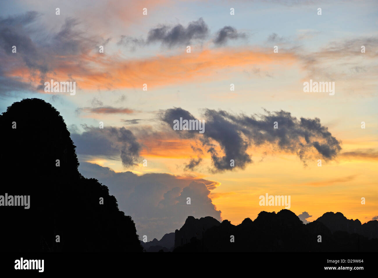 Karst peaks at Halong Bay, Vietnam at sunset Stock Photo