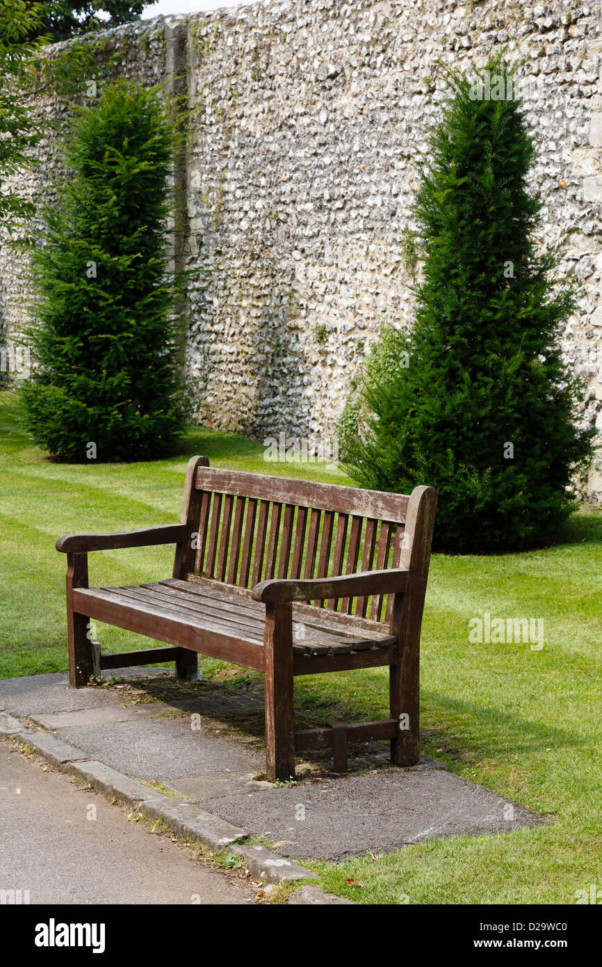 Wooden bench in a park in Winchester, Hampshire, UK Stock Photo