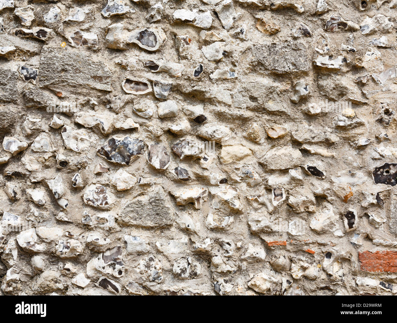 Closeup of an ancient flint and stonework castle wall Stock Photo