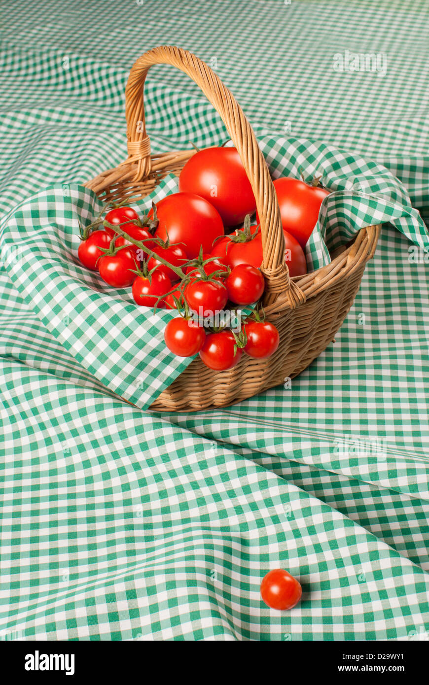 Traditional basket full of ripe tomatoes Stock Photo - Alamy