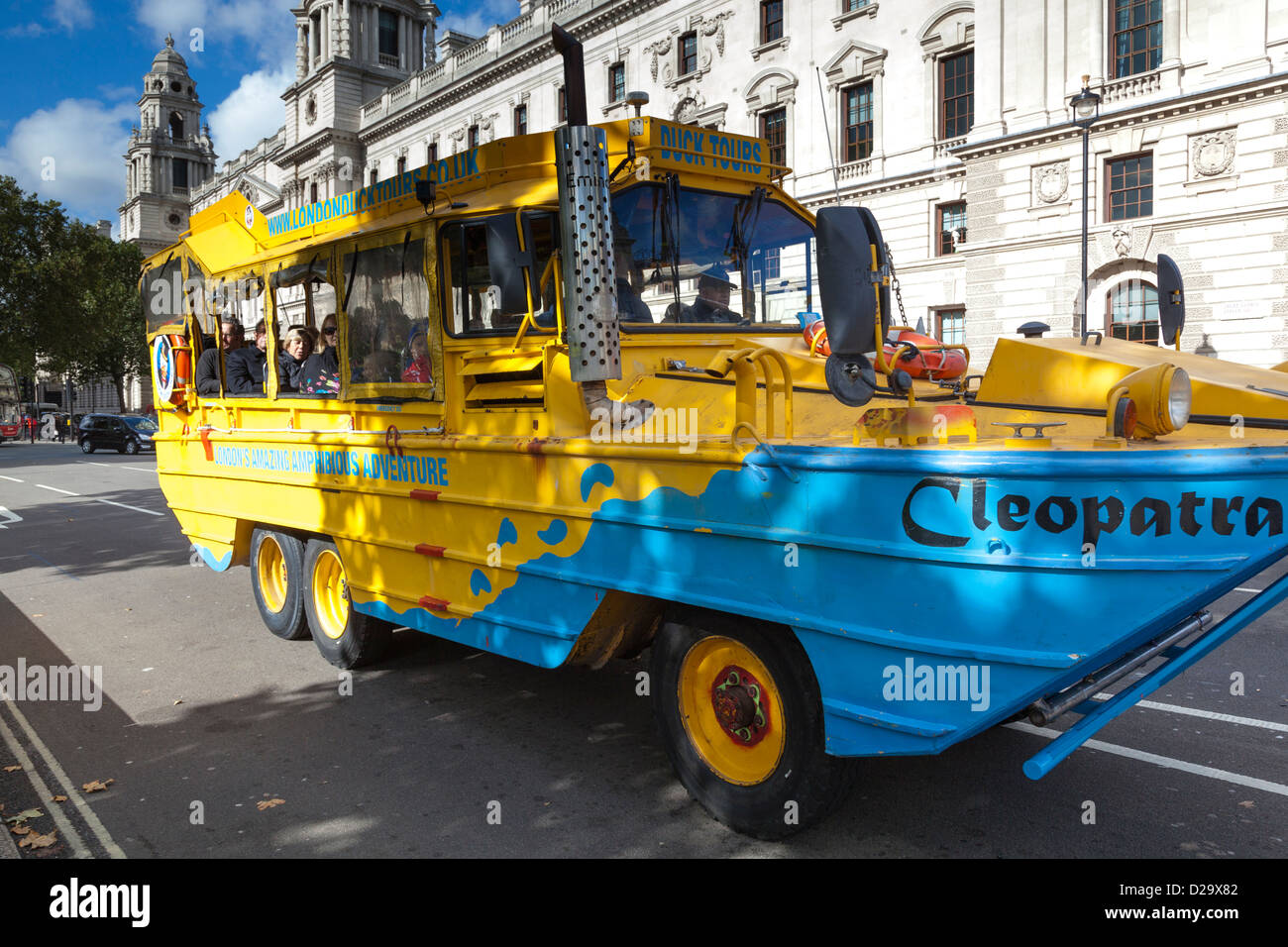 DUKW (Duck) amphibious vehicle transports a group of tourists through London. Stock Photo