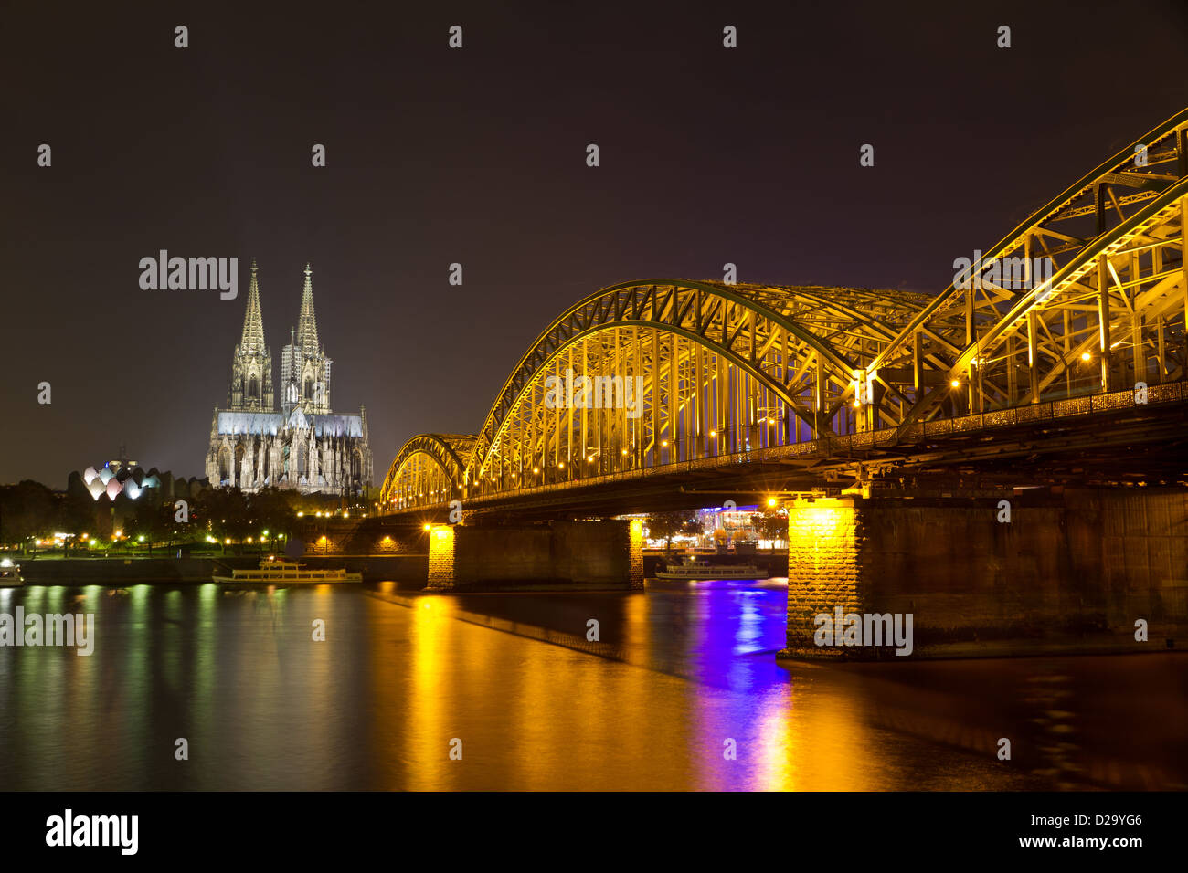 Cologne Cathedral and Hohenzollern Bridge at night, Cologne (Köln), Germany Stock Photo