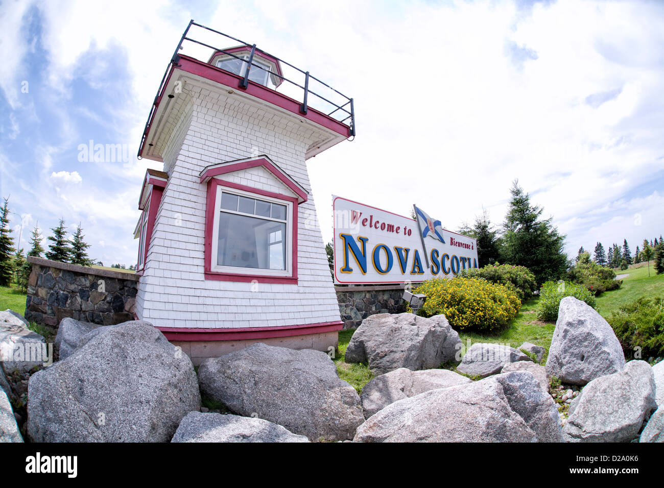 Nove Scotia, light house and tourist office, sitting on the rocks under a beautiful blue sky. Stock Photo