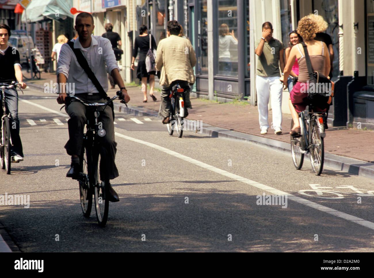 Netherlands. Amsterdam. Cyclists On Haarlemmerdijk. Stock Photo