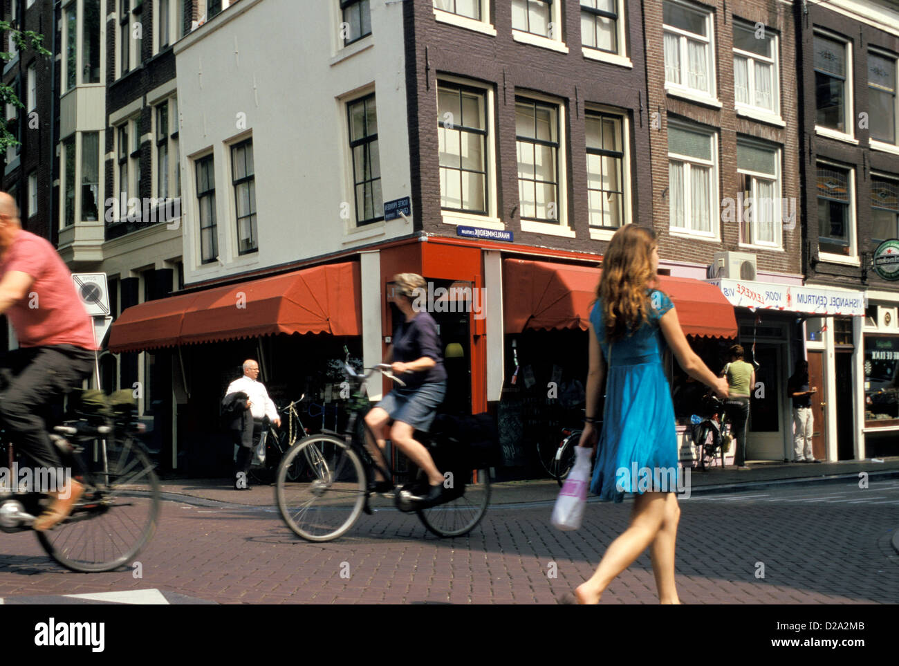 Netherlands. Amsterdam. Cyclists And Pedestrians On Haarlemmerdijk. Stock Photo