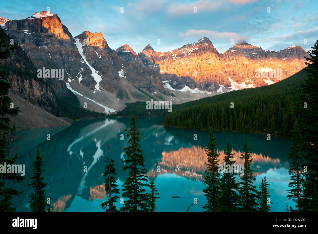 Early light on the Wenkchemna Peakks reflected in Moraine Lake, Banff National Park, Canadian Rockies, Alberta, Canada. Stock Photo